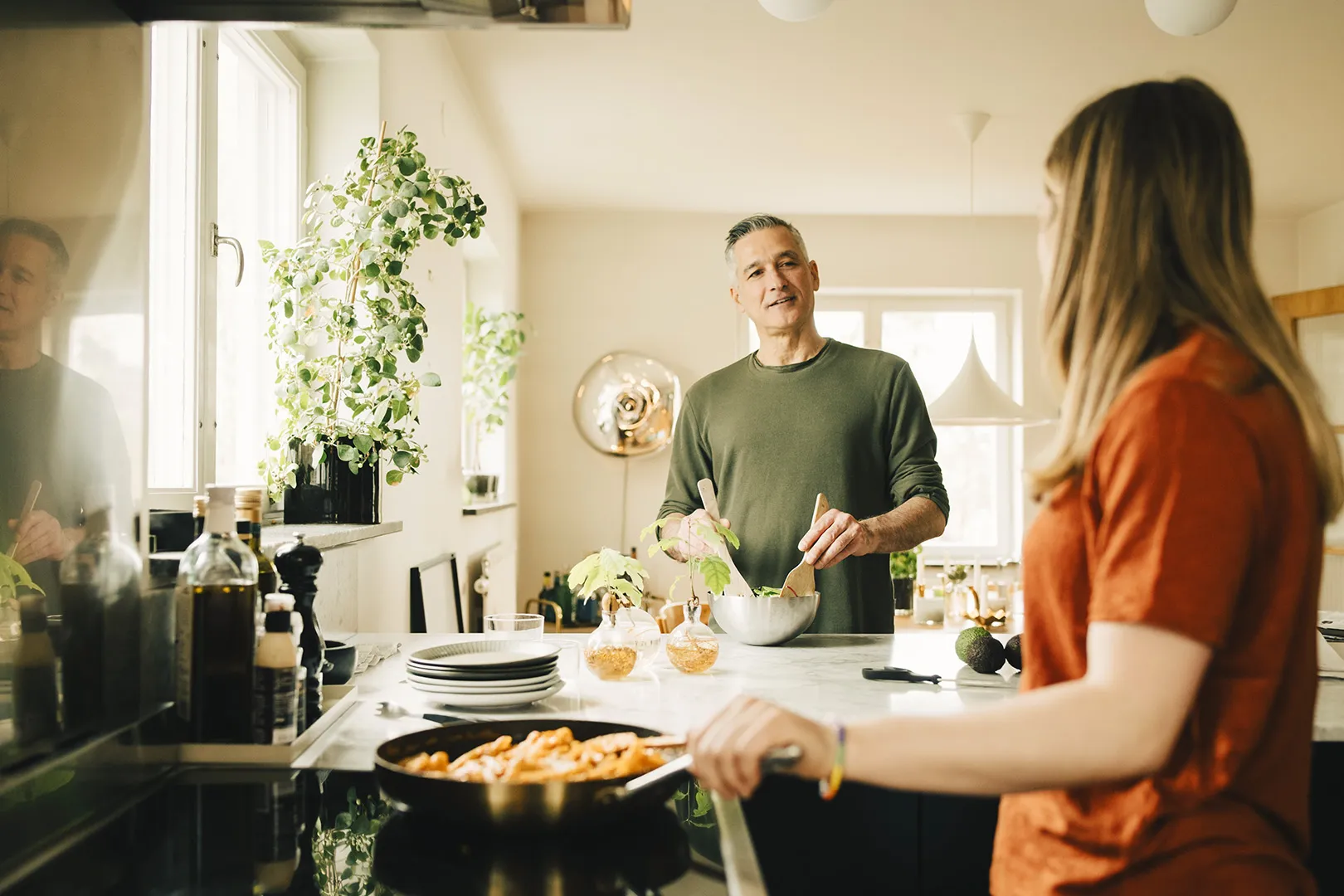 dad and daughter prepping meal in the kitchen