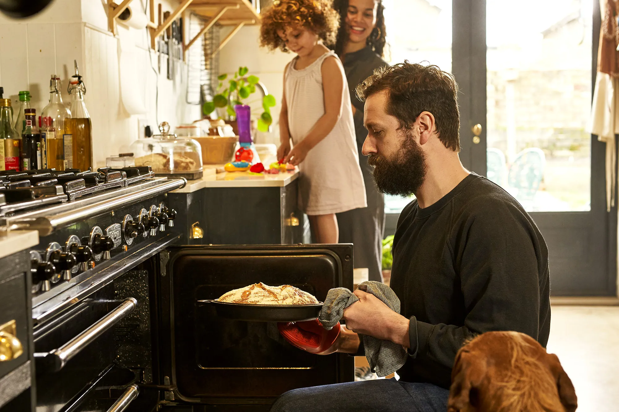 dad taking food out of the oven