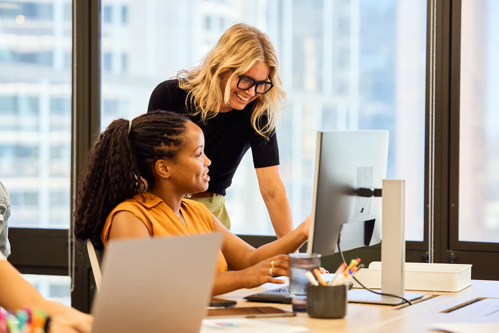 women working at desk together